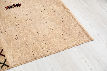 Beautiful soft carpet on wooden floor