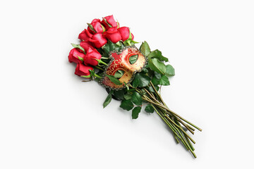 Bouquet of beautiful red roses and mask on white background