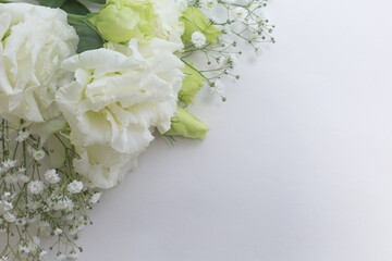 Flower frame, eustoma of a white and delicate color on a light background.