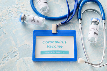Vaccine for immunization against COVID-19 and stethoscope on table