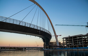 Obraz premium Dubai, UAE - 01.08.2021 Bridge over a Dubai Water canal known as Tolerance bridge. Outdoors