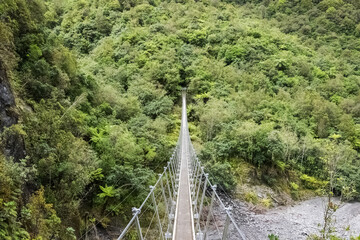 Fototapeta na wymiar Suspension bridge on roberts point track in New Zealand