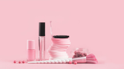 Tender pink monochrome feminine makeup tools and accessories. brushes blush lipstick vanish on...