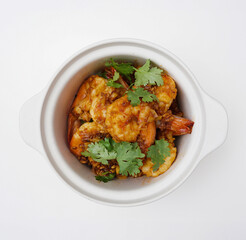Deep fried shrimps with garlic and coriander in a bowl isolated, Top down view of Thai food on a white background