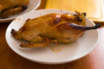 Duck baked in the oven, stuffed with apples
