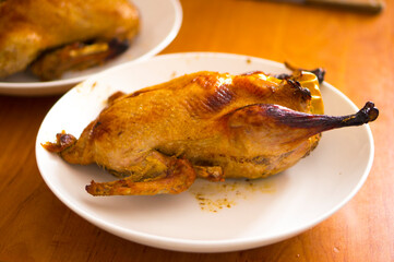 Duck baked in the oven, stuffed with apples