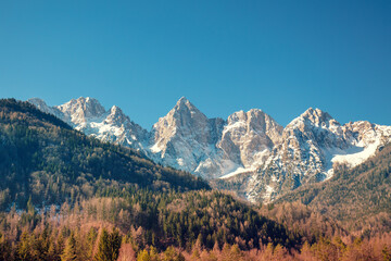 View of Alps in Kranjska Gora on a sunny day. The tops of the mountains are covered with snow. Triglav national park. Slovenia, Europe