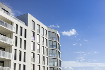 Newly build uninhabited modern white building with blue sky