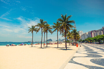 Palms on Copacabana Beach next to landmark mosaic in Rio de Janeiro, Brazil - obrazy, fototapety, plakaty