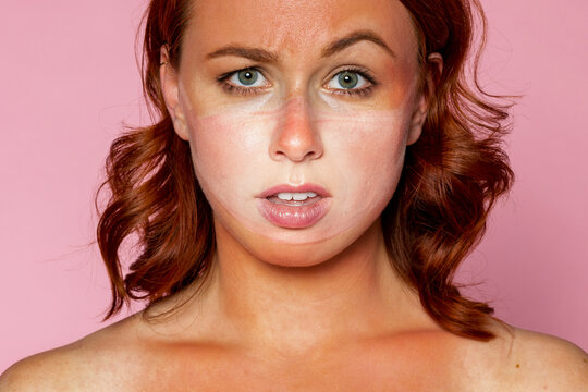 Face mask tan line on an upset woman&#39;s face