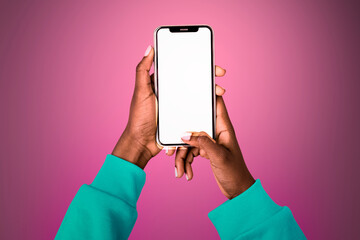 Empty glowing screen with person holding mobile phone