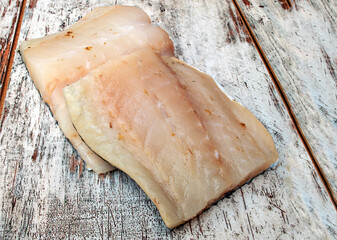Cod pieces surrounded by rustic background