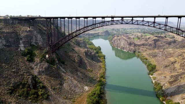 Aerial view of the Perrine Memorial Bridge over the snake river in Twin Falls, Idaho. With cars driving across the bridge.