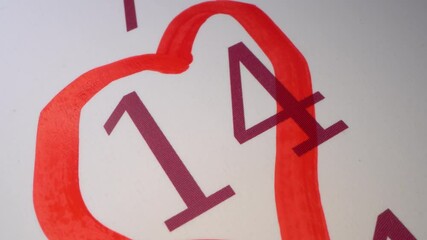 Heart, Valentine's day, 14 February. Marking the date in the calendar with a red marker. The fourteenth day of the month