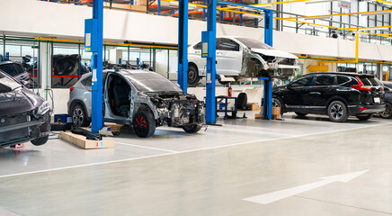 Naklejka premium broken car and engine failure maintenance by repair man and engineer in workshop maintenance after car showroom business for transpiration