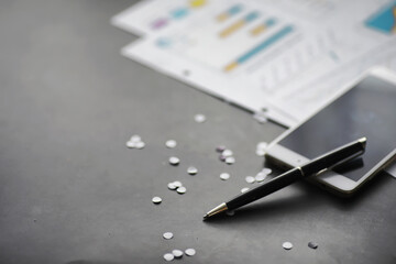 Working time symbolizes the desktop. Office desk with papers from an insurance manager and banker. Office worker at the table. The concept of lack of time.