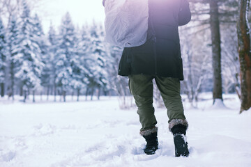 Bearded man in the winter woods. Attractive happy young man with beard walk in the park.