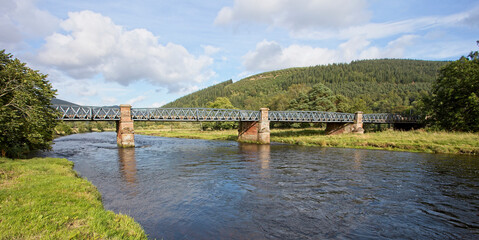 A girder road bridge over the River Tweed, near Innerleithen, Scottish Borders, Scotland, UK.