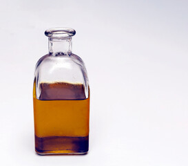 Bottle of olive oil surrounded by white background