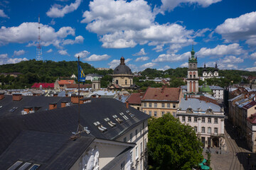 Naklejka na ściany i meble Aerial view on Market square, Dormition, Dominican and Carmelite Church in Lviv, Ukraine from drone