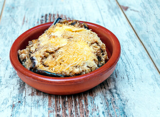 Stuffed eggplant surrounded by rustic background