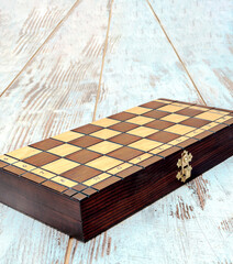 Obraz na płótnie Canvas Chess pieces on a wooden board