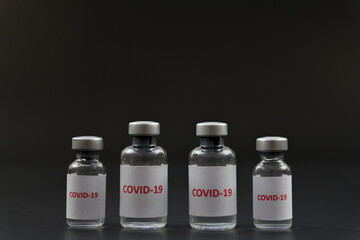 Corona virus vaccine in bottles. The medical concept.