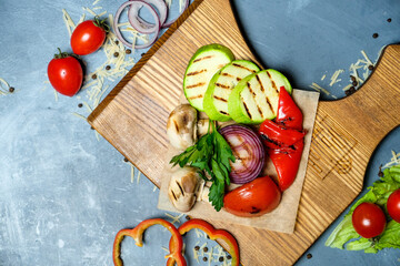 vegetables baked on a board with herbs top and side view