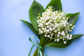 mockup greeting card. spring composition. bouquet of lilies of the valley and space for text. congratulation. invitation