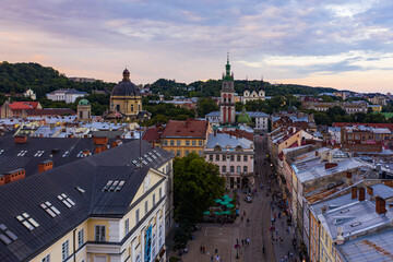 Fototapeta na wymiar Aerial view on Market square, Dormition, Dominican and Carmelite Church in Lviv, Ukraine from drone