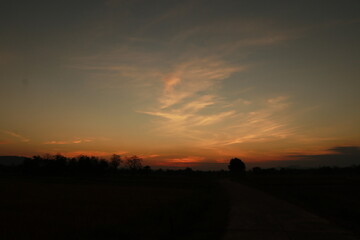 Fototapeta na wymiar The Orange light of Sunrise ,silhouette and blue sky in the morning