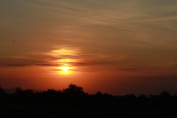Fototapeta na wymiar Golden light of Sunrise and silhouette in the morning
