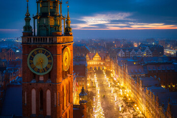 Beautiful clock of the town hall in Gdansk at night, Poland