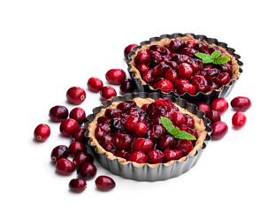 Delicious cranberry tarts in baking mold isolated on white