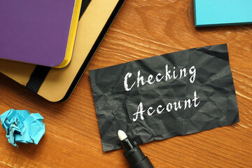 Business concept about Checking Account with phrase on the piece of paper.