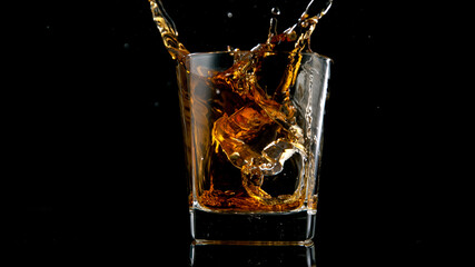 Ice Cube falling into Glass of Whisky, Freeze Motion.