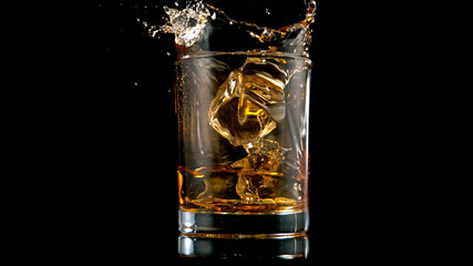 Ice Cube falling into Glass of Whisky, Freeze Motion.