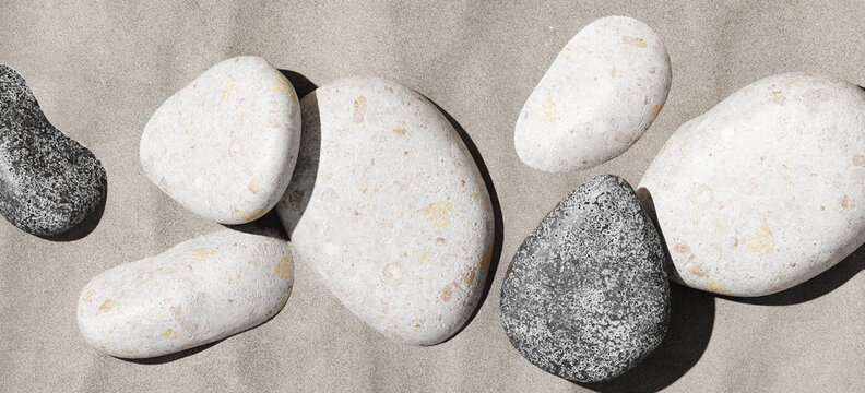 Minimal mockup background for product presentation. Top view of river pebble stone on sand beach. Clipping path of each element included. 3d rendering illustration. 