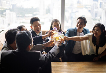 Happiness small Asia business new year party at restaurant after work.