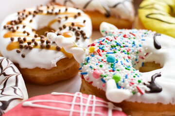 Assortment of decorated donuts with glaze