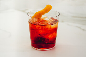Negroni Cocktail with an Orange Twist in a Tumbler, made with Gin, Red Vermouth and Bitter