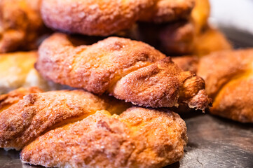 A stack of freshly baked flax braids in close-up