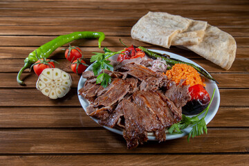Turkish doner kebab with vegetable and over vintage wooden table