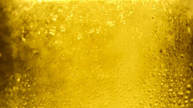 Video for beer advertising background. Cold Light Beer in a glass with water drops. Beer background