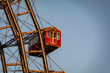 Historic Ferris wheel of the famous Vienna Prater Park with its wooden red carriages. One of the main sighting points in Vienna, Austria 