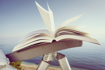 Open book outdoors. Reading