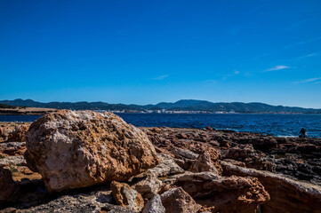 Fototapeta na wymiar View on Balearic sea from Ibiza coast, rocks, sunny day of April 2018