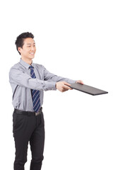 Business man holding notebook posing in studio 