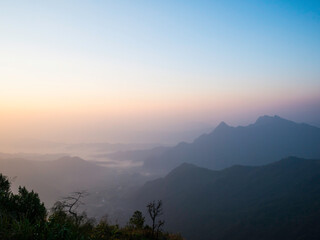 Sunrise over the mountain range at the north of thailand - 404013658