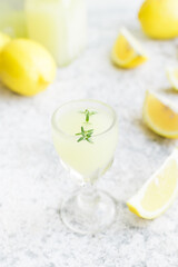Italian traditional liqueur limoncello with thyme